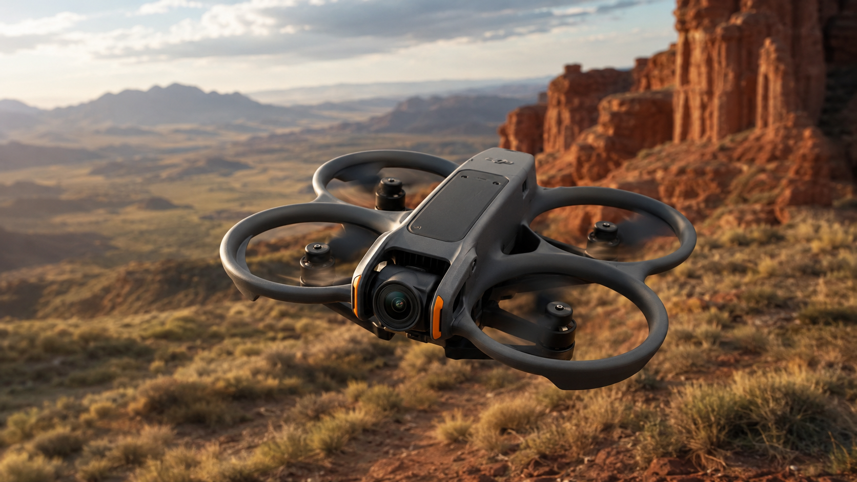 Protected DJI Avata 2 FPV drone flying over open terrain with goggles and a motion controller nearby.