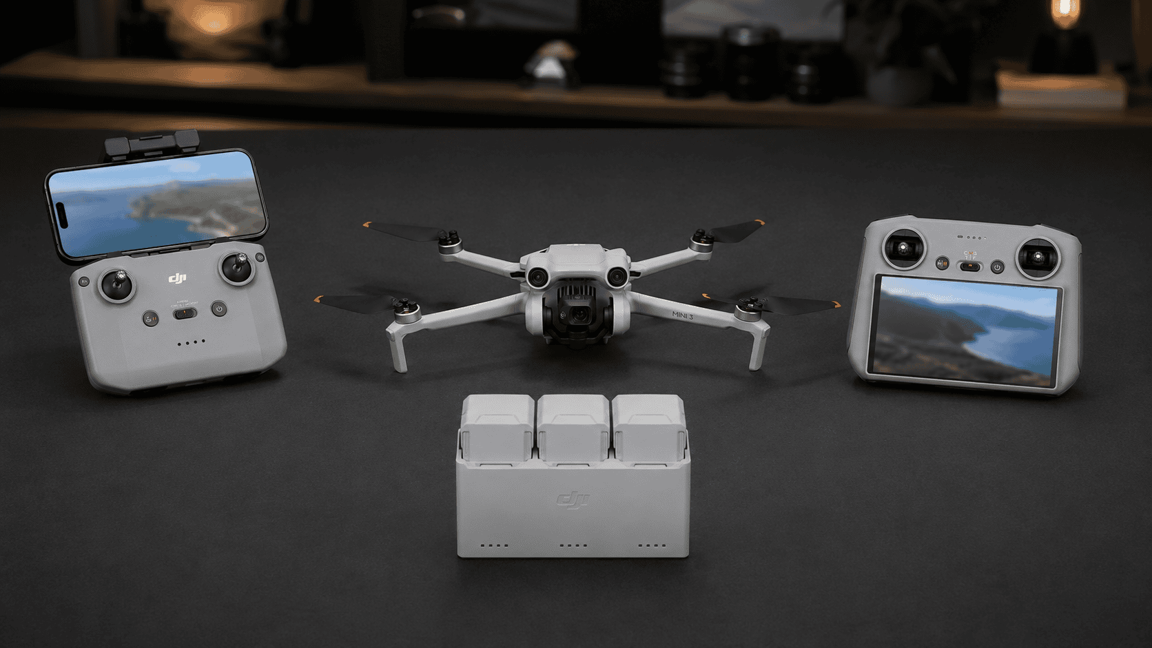 DJI Mini 3 shown with RC-N1, DJI RC, batteries, charging hub and shoulder bag.
