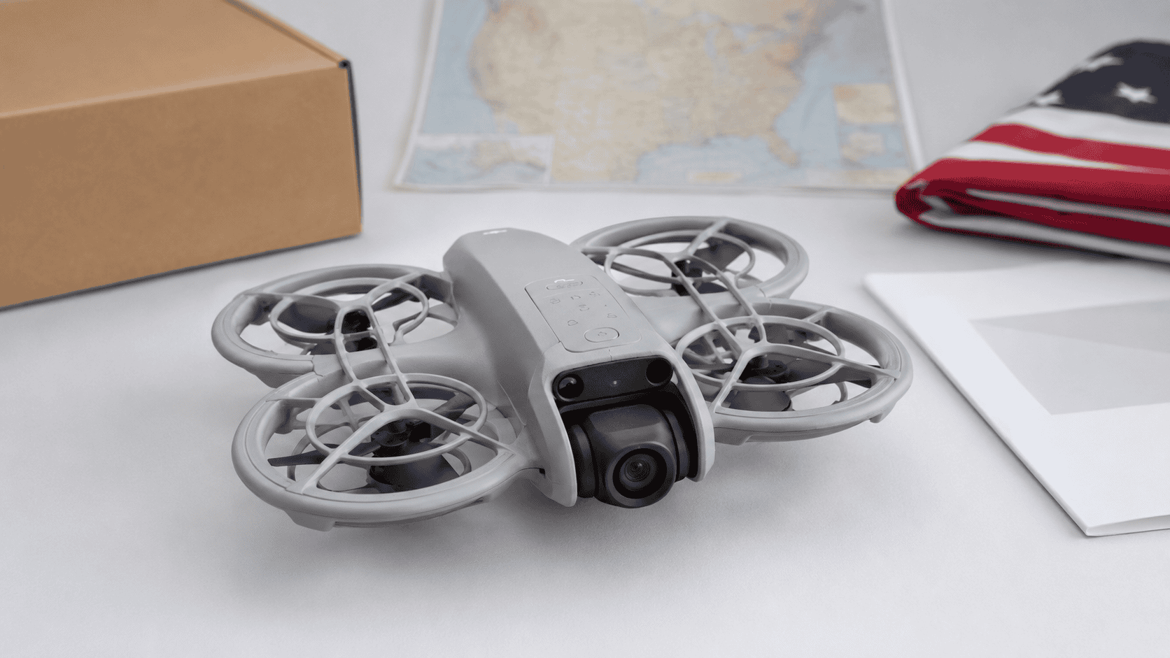 DJI Neo 2 beside a U.S. map with warranty, shipping, and return-checklist symbols.