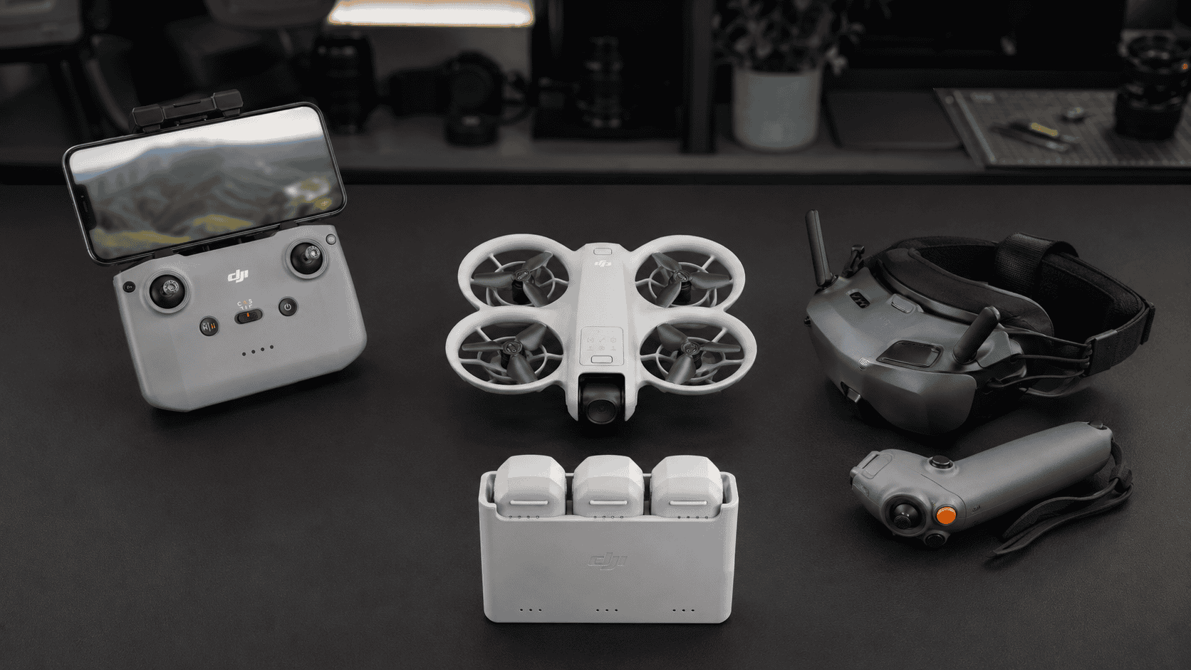 DJI Neo displayed with RC-N3, batteries, charging hub, Goggles N3, and RC Motion 3.