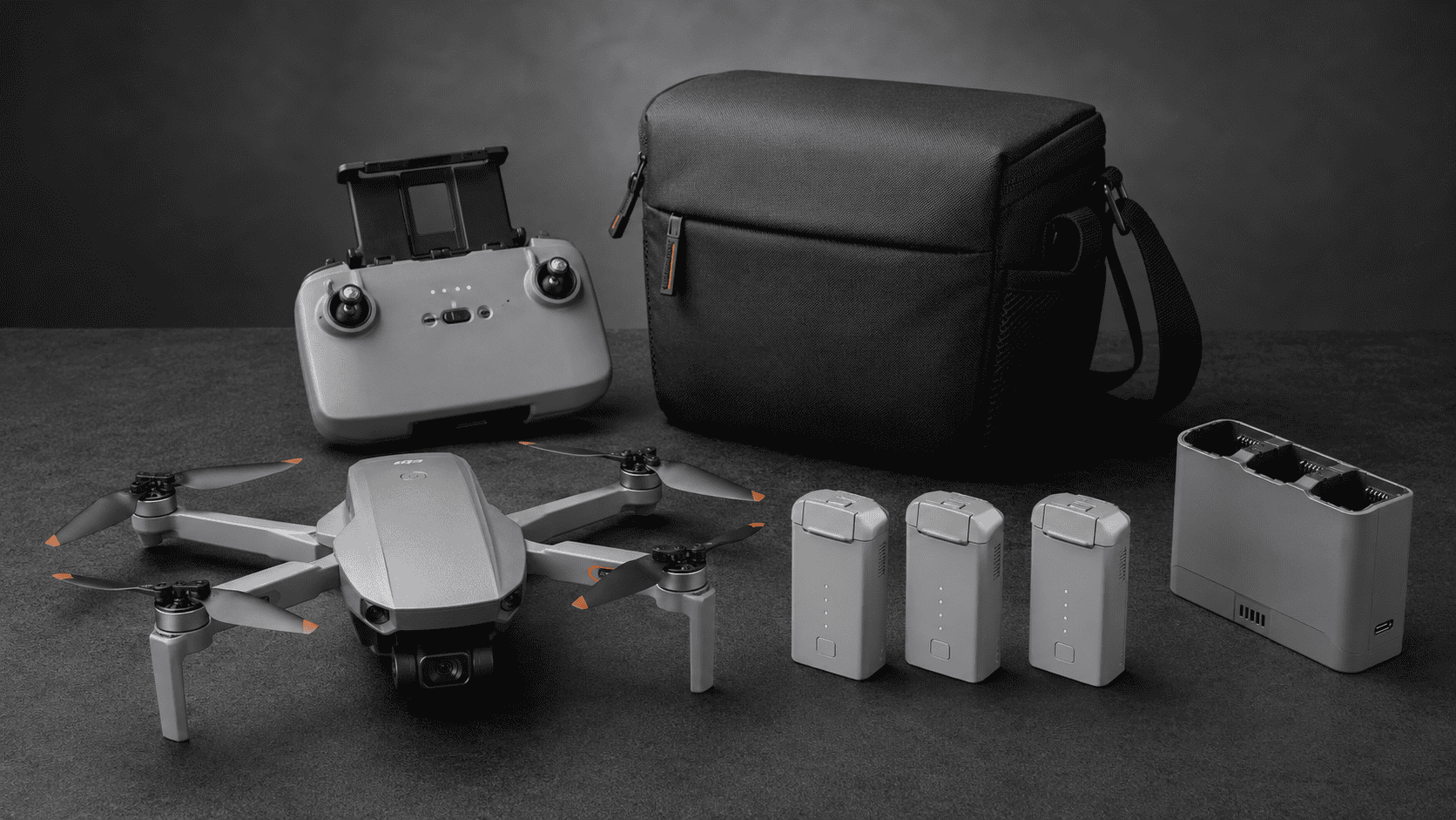 ATOM SE drone with controller, carrying bag, three batteries, and fast charging hub